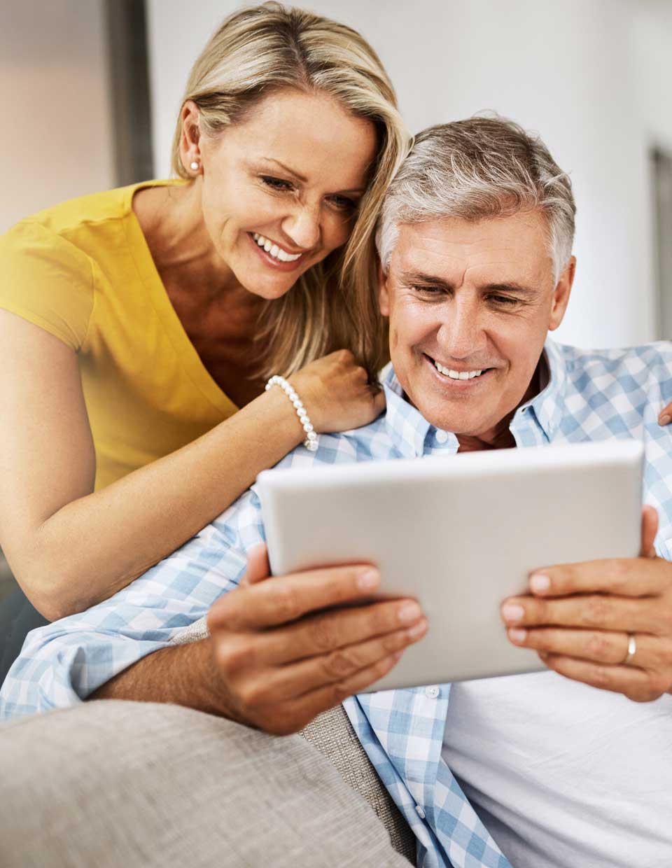 promo image for couple reviewing digital investment portfolio performance on ipad